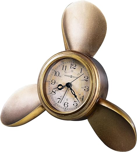 Howard Miller Propeller Alarm Table Clock 645-525 – Antique Brass Finish, Antique Parchment Dial, Arabic Numerals, Antique Home Décor, Quartz Movement