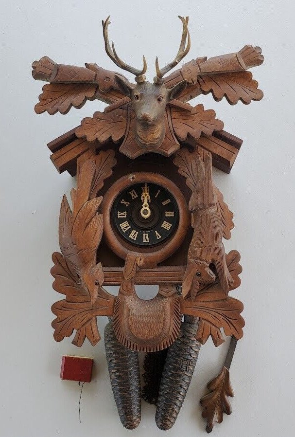 A Schneider Hand-Carved Walnut Black Forest Hunter Cuckoo Clock Germany 8 Day