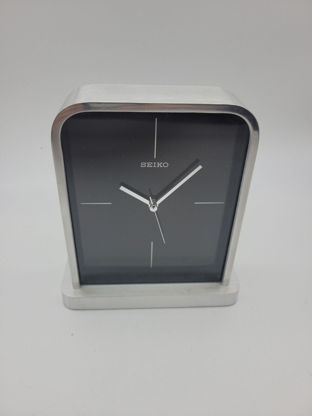SEIKO QUARTZ STAINLESS STEEL BLACK DIAL SQUARE CLOCK QHE063SL