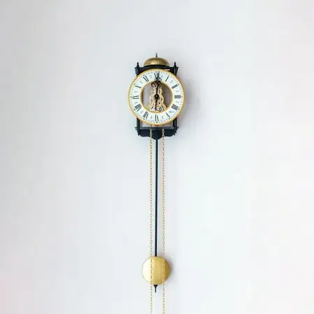 Hermle 25 Black and Gold Round Skeleton Pendulum Wall Clock