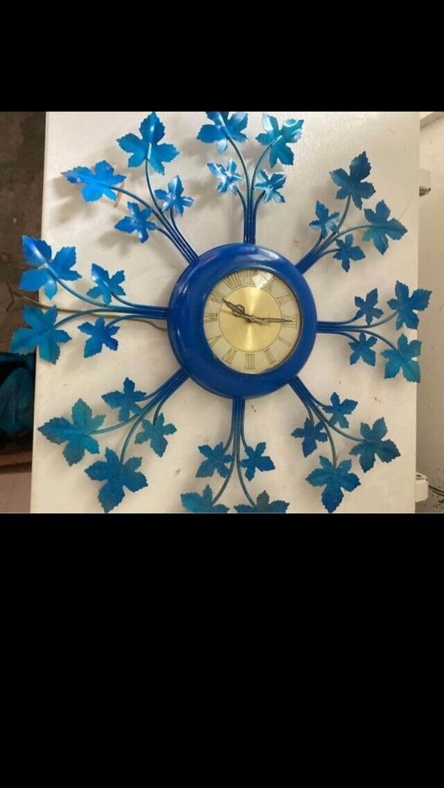 Mid century vintage sunburst Blue color leaf metal wall clock.