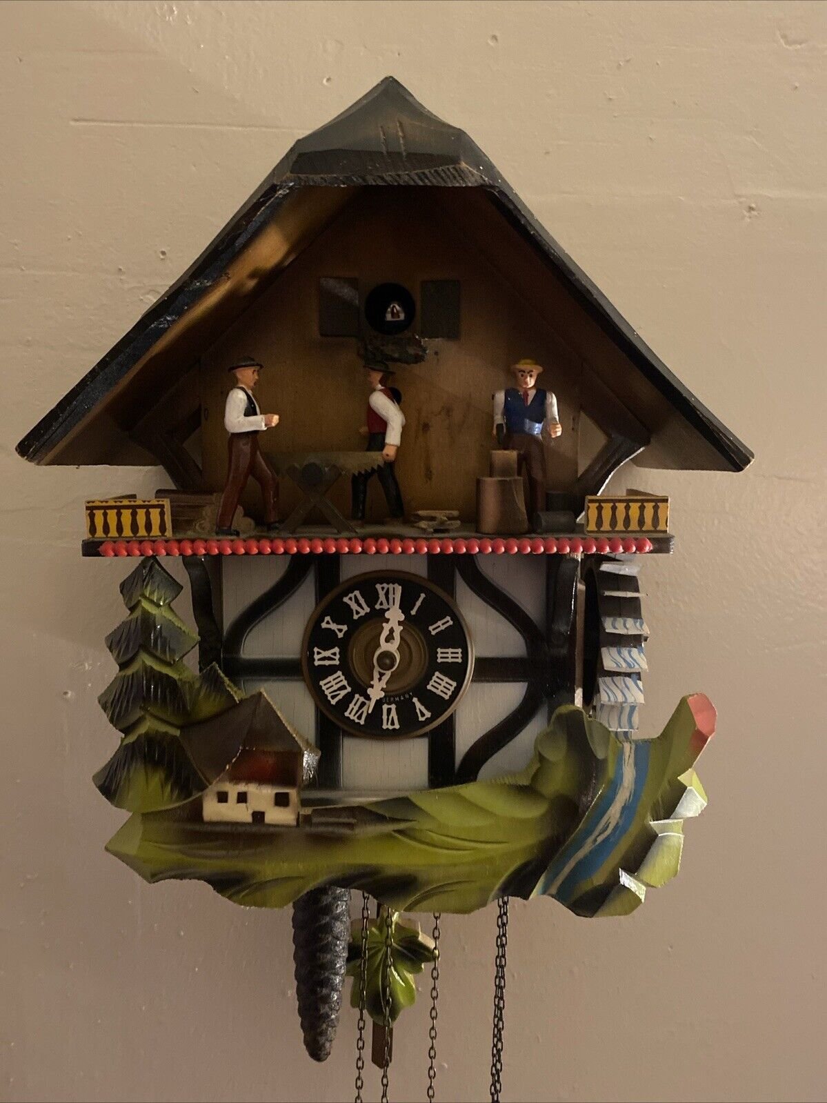 Vintage GERMAN MUSICAL Cuckoo Clock with Men Chopping. Sawing/ Water Wheel