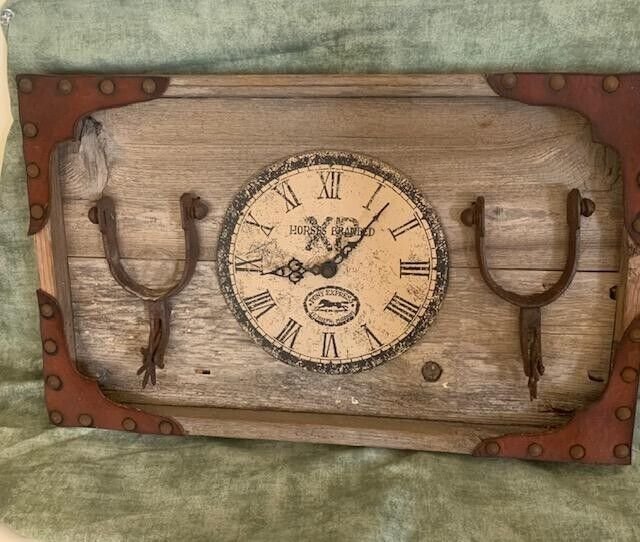Wall hanging feat. Western horseshoes (clock is not working). Sold as artwork