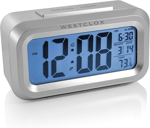 Westclox Travel Alarm Clock with Large Digital Display and Blue Backlight on Demand, Alarm Clock, Month/Date and Temperature Display with Ascending 5 Minute Snooze Alarm, Silver