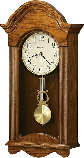 Howard Miller Jayla Wall Clock 625-467 – Legacy Oak Finish Wood Frame, Vintage Home Decor, Brushed Brass Finished Pendulum, Quartz, Single-Chime Movement